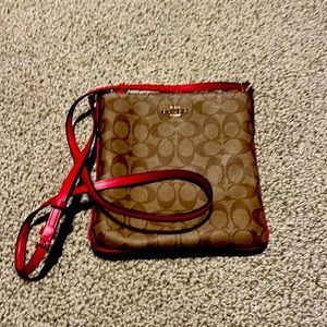 Coach cross body purse with hot pink strap and piping. Excellent condition